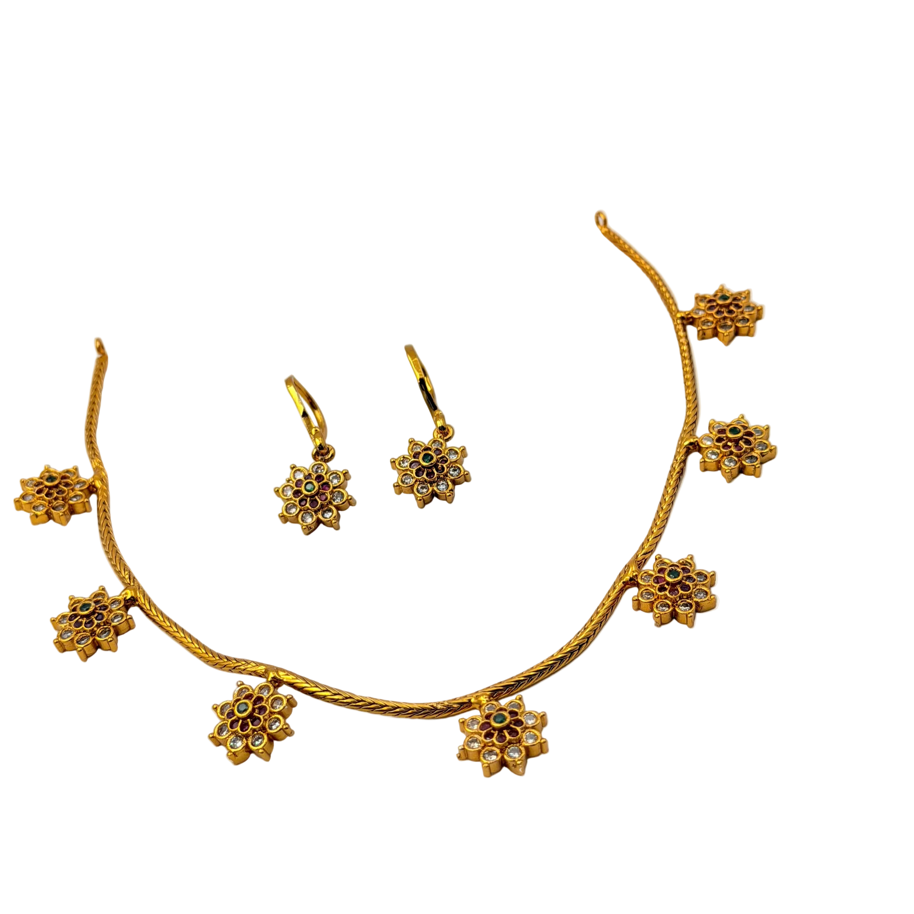 Gold necklace and earrings set on a white background