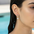 Gold checkered earrings with CZ stones