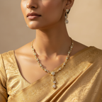Gold-plated crystal necklace and earrings set with star motif, worn by model in gold saree
