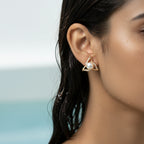 Gold Pearl Bloom stud earring with CZ pave and faux pearl center, on-ear close-up shot