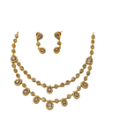 Gold necklace and earrings set on a white background