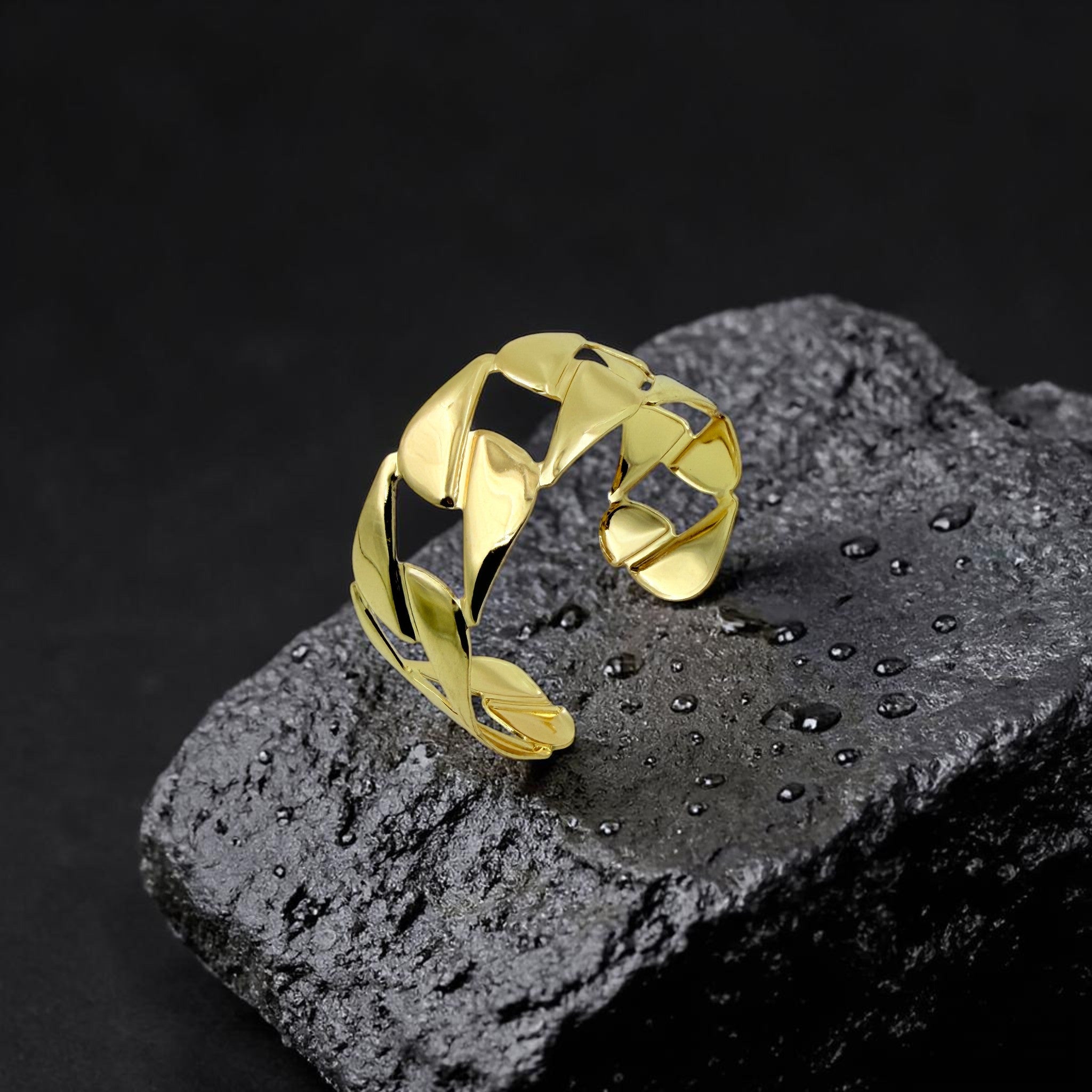 Gold bracelet on a textured black surface