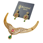 Gold necklace with red and green gemstones on a Krystal Jewels card