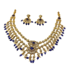 Gold and blue necklace set on a white background