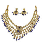 Gold and blue necklace set on a white background
