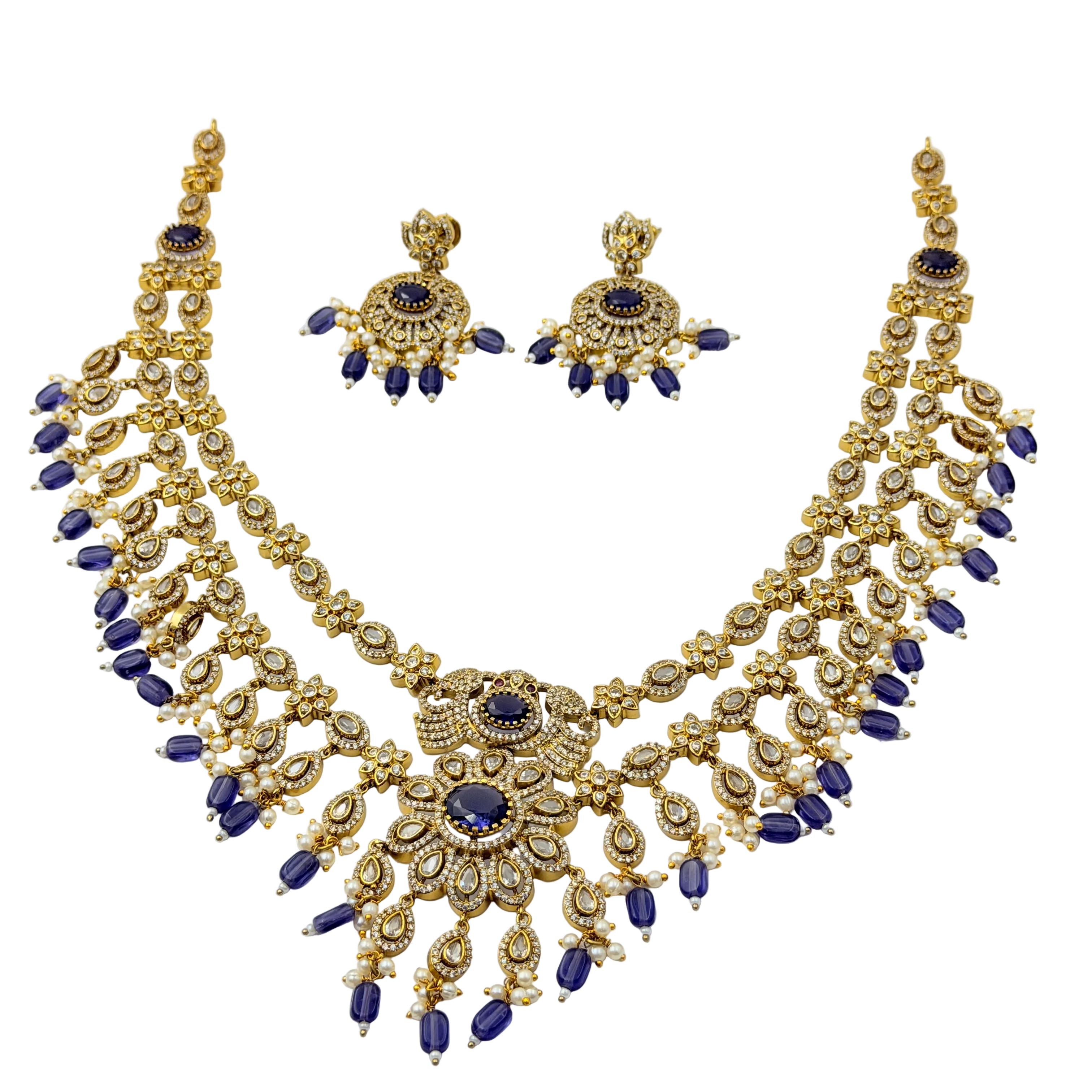 Gold and blue necklace set on a white background