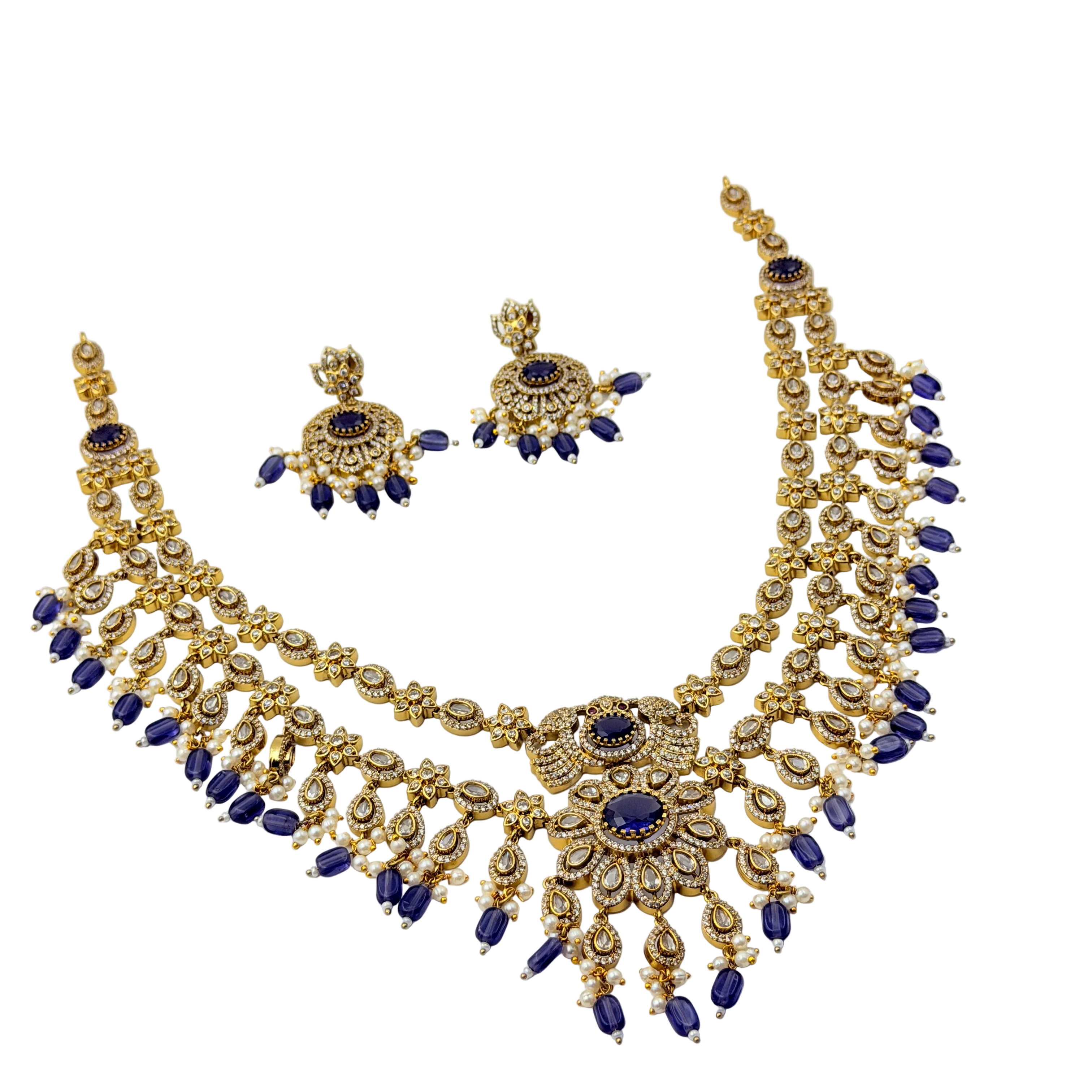 Gold and blue necklace set on a white background