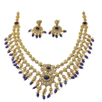 Gold and blue necklace set on a white background