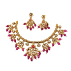 Gold necklace with pink gemstones on a white background