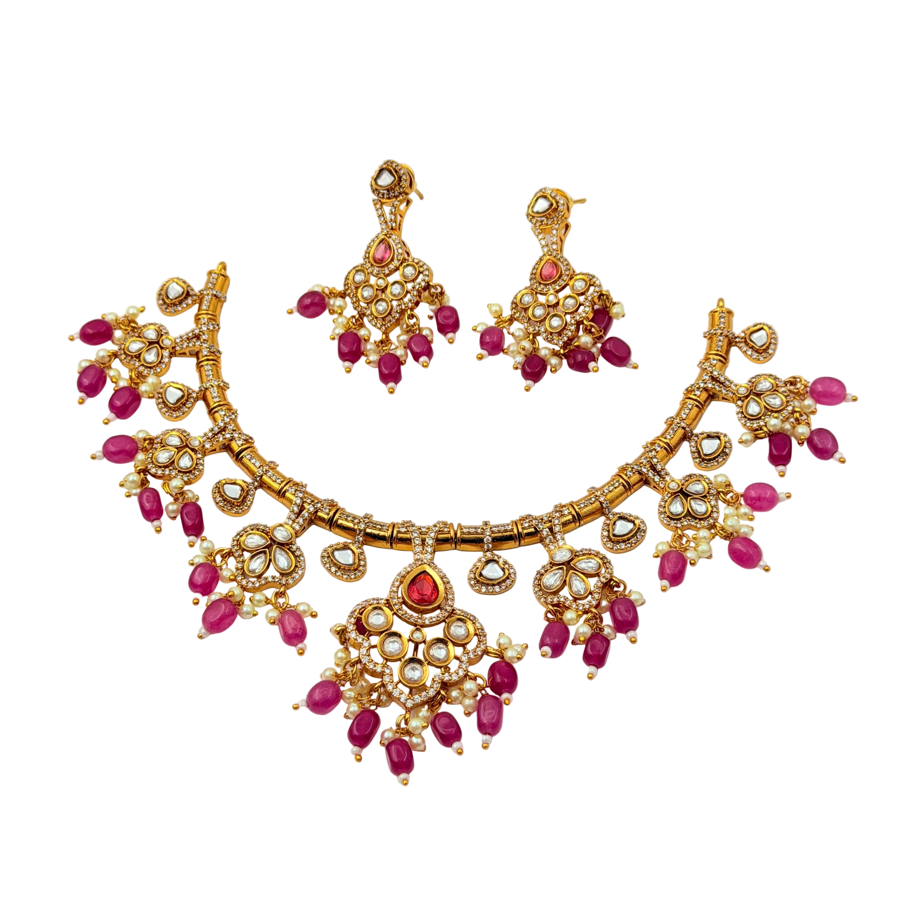 Gold necklace with pink gemstones on a white background