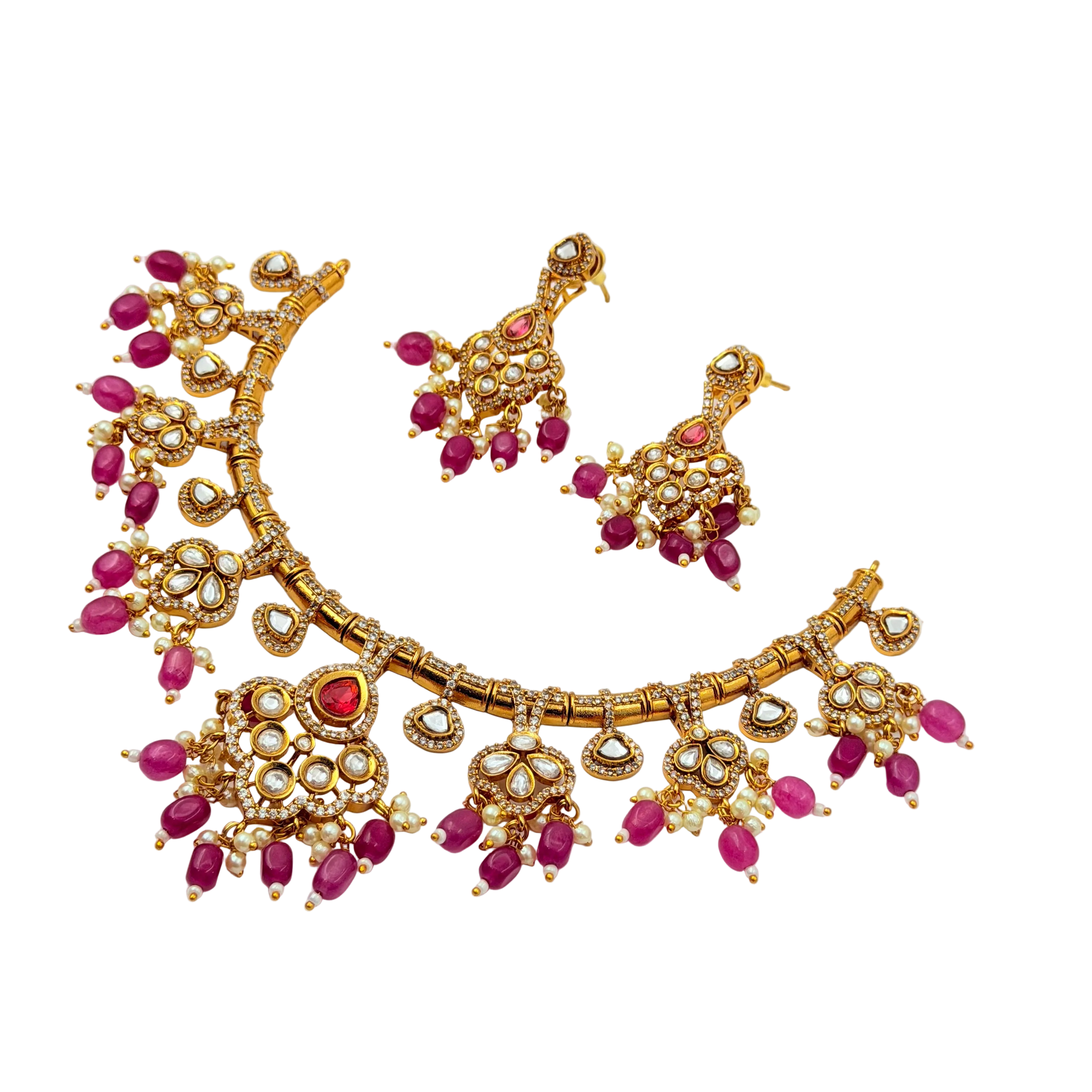 Gold necklace with pink stones on a white background