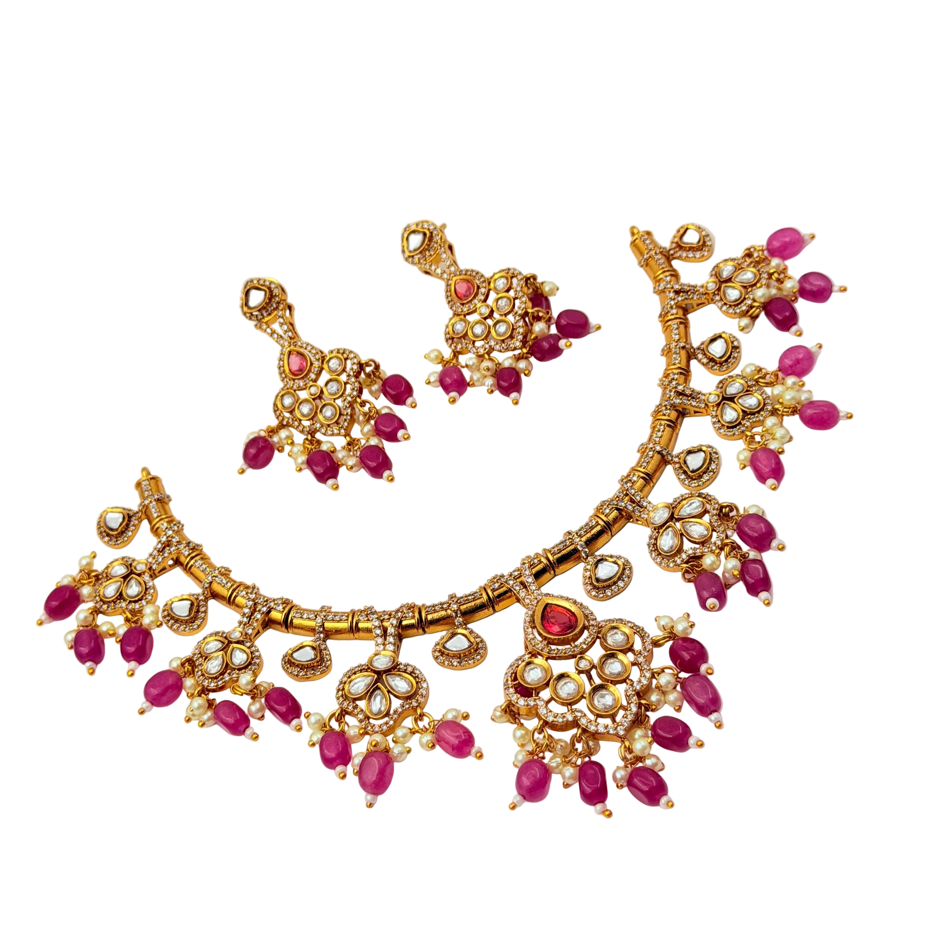 Gold necklace with pink gemstones on a white background