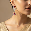 Pair of earrings with red gemstones
