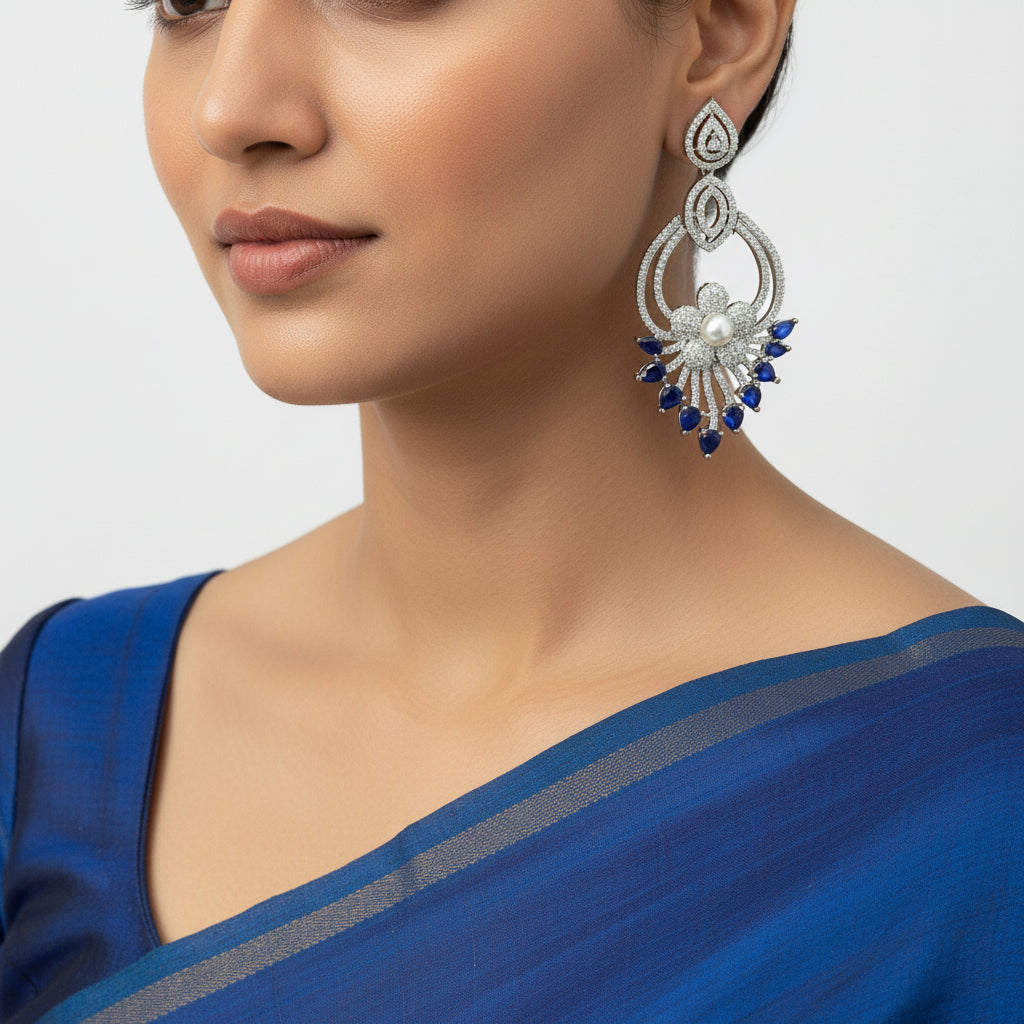 Pair of silver earrings with blue stones