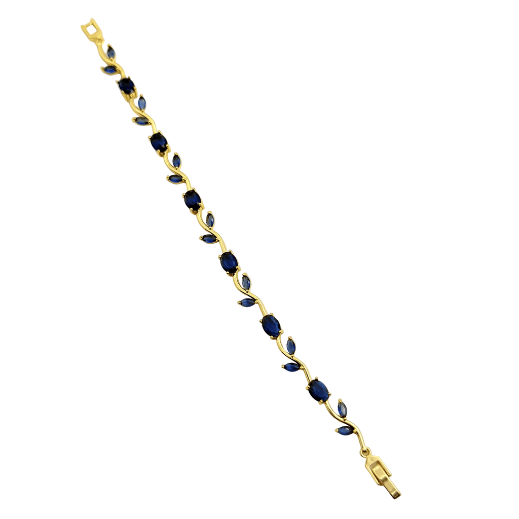 Gold bracelet with blue stones on a white background