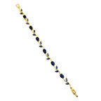 Gold bracelet with blue stones on a white background