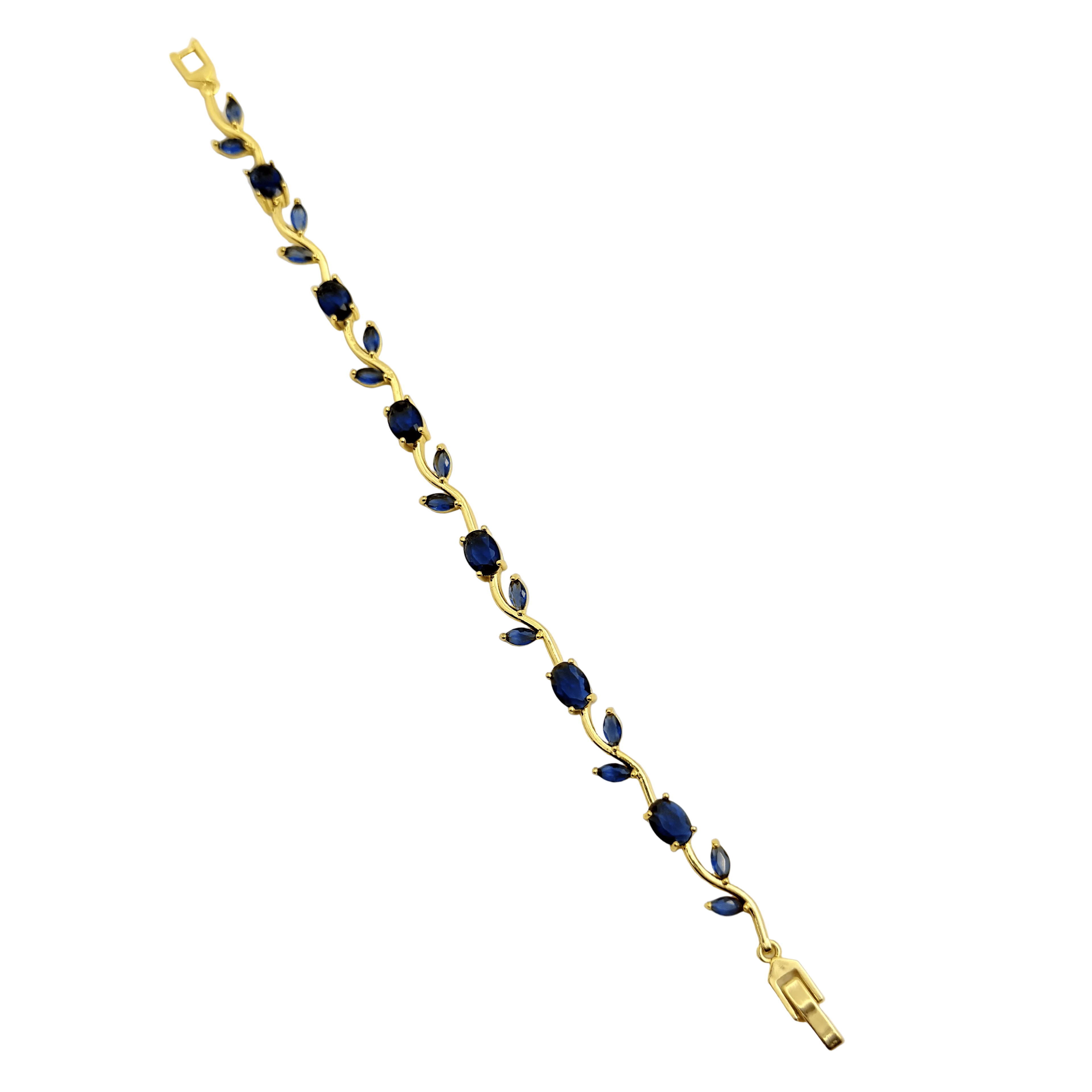 Gold bracelet with blue stones on a white background