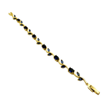 Gold bracelet with blue stones on a white background