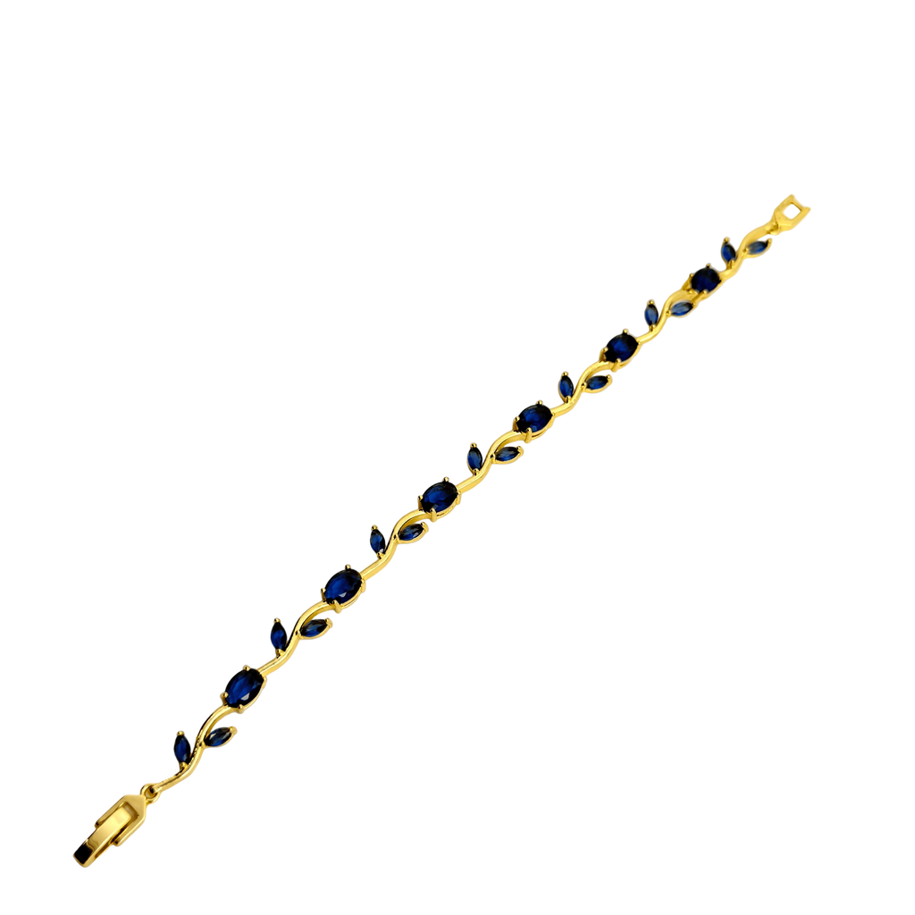 Gold bracelet with blue stones on a white background