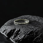 Swarovski bracelet on a textured black surface with a dark background