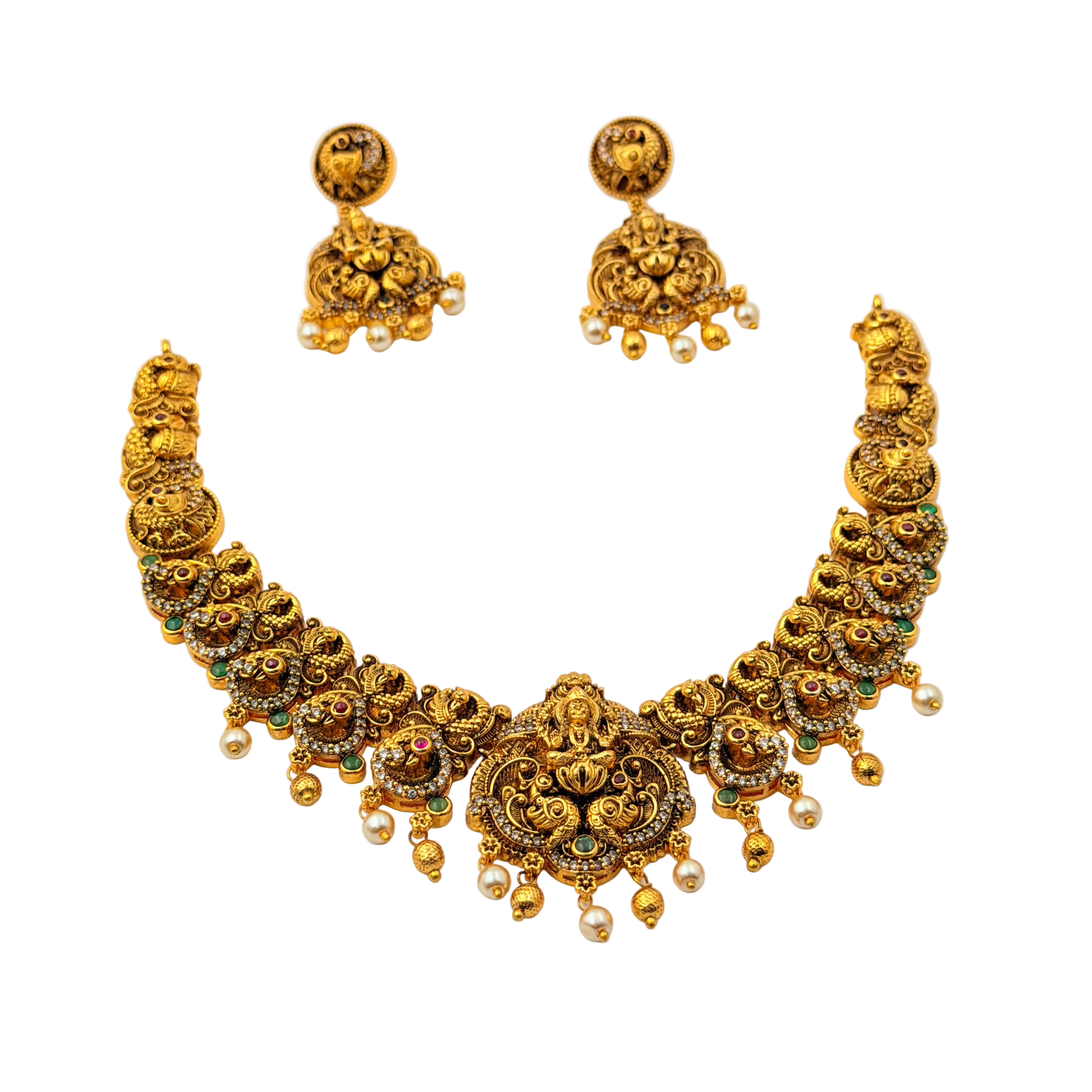 Gold necklace and earrings set on a white background