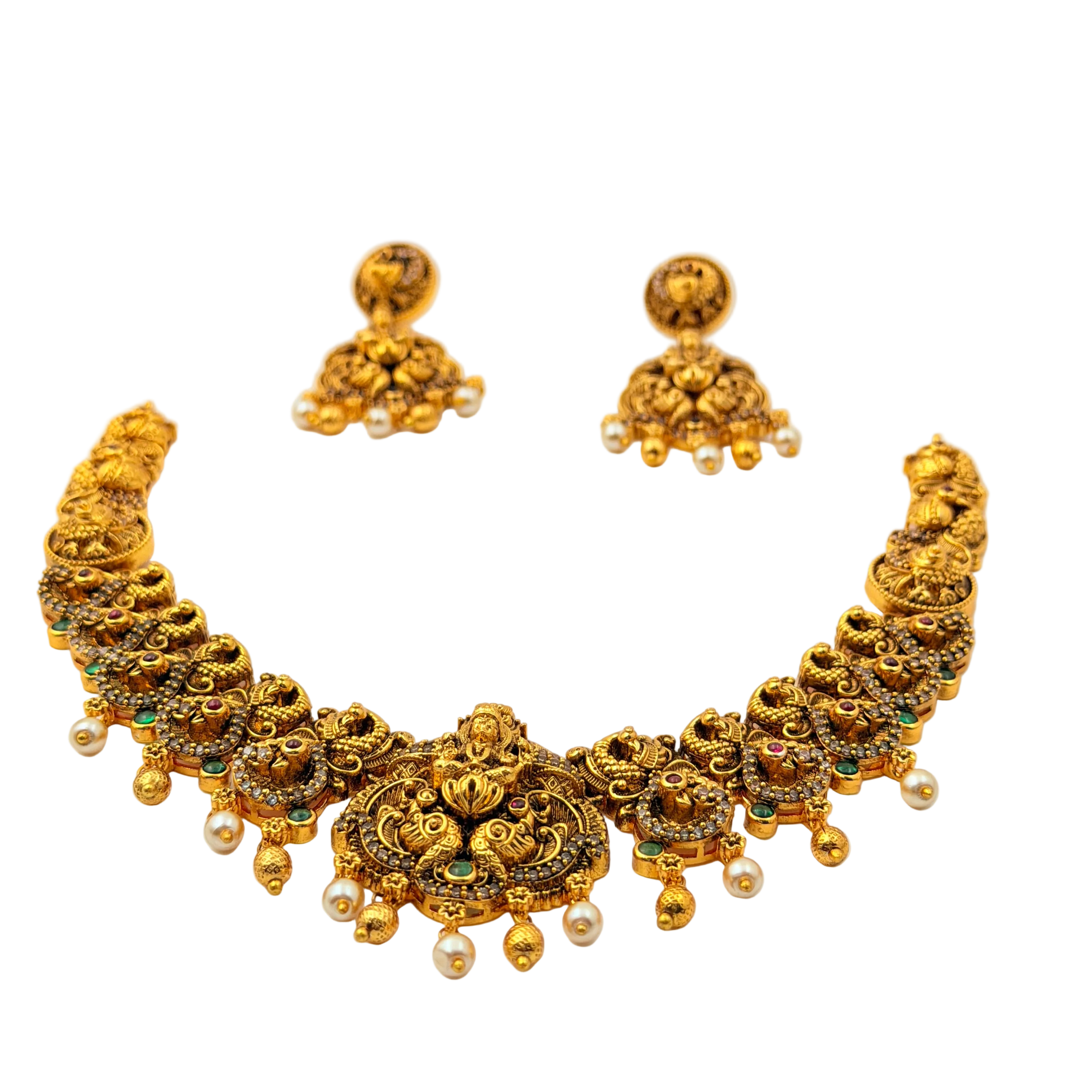 Gold necklace and earrings set on a white background