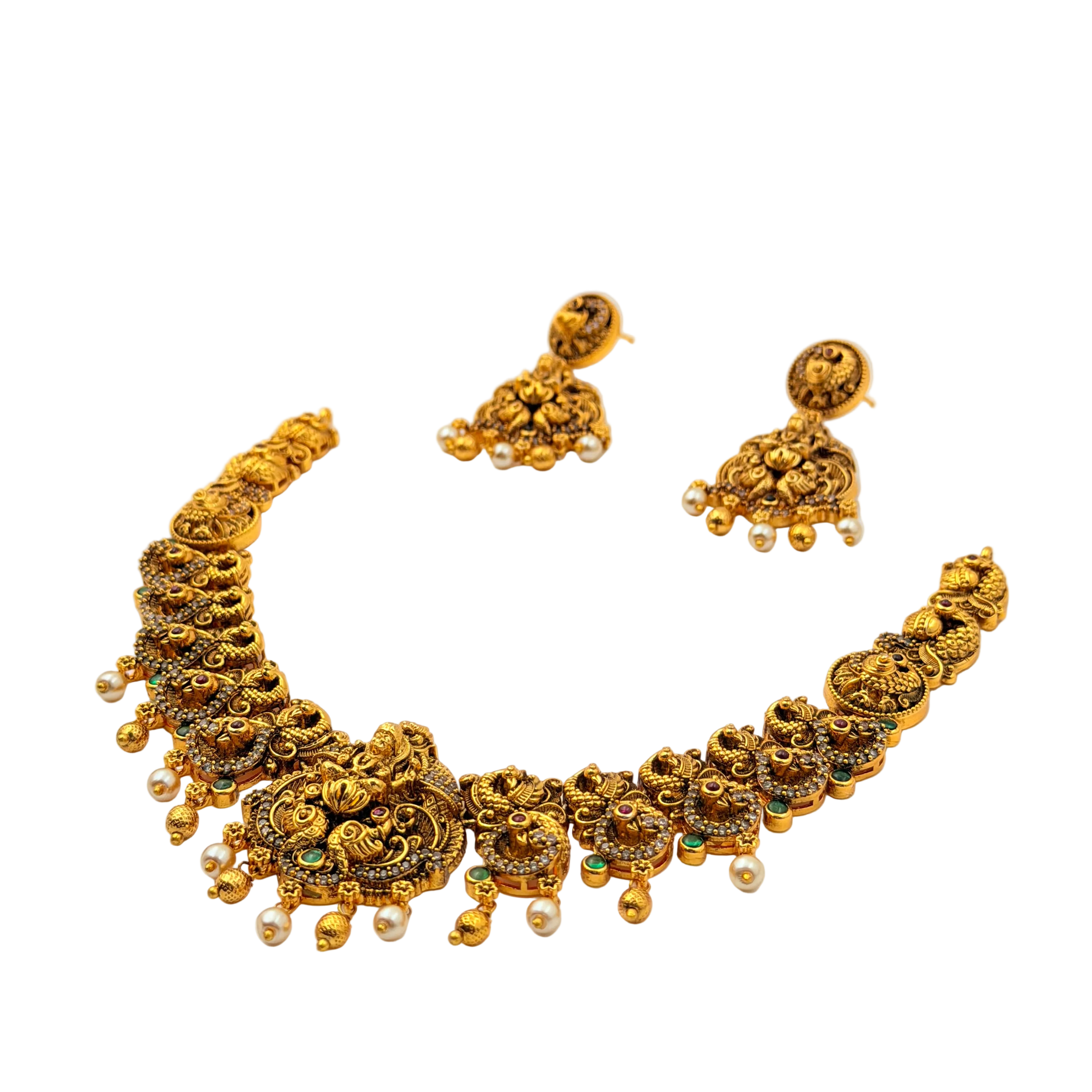 Gold necklace and earrings set on a white background