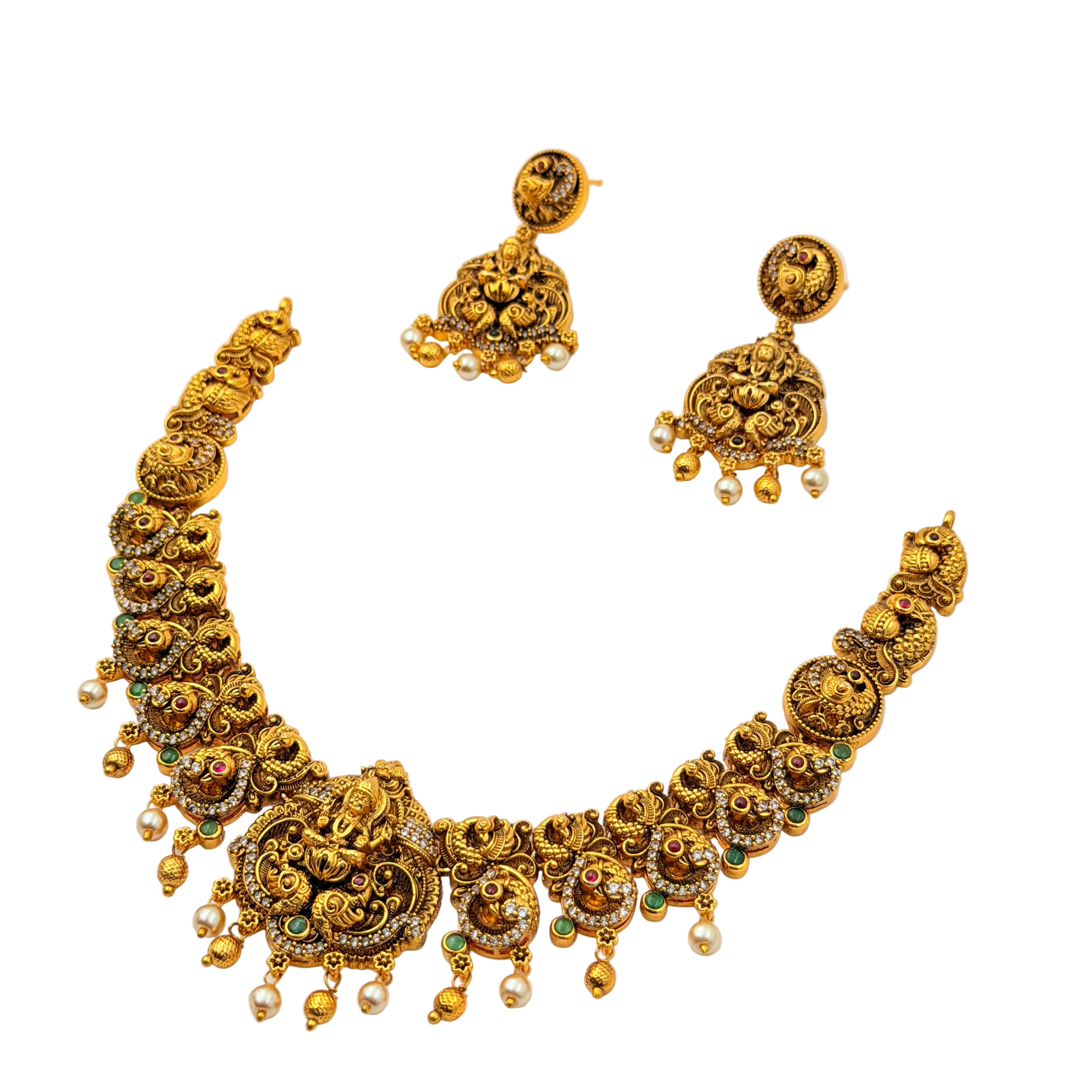 Gold necklace and earrings set on a white background