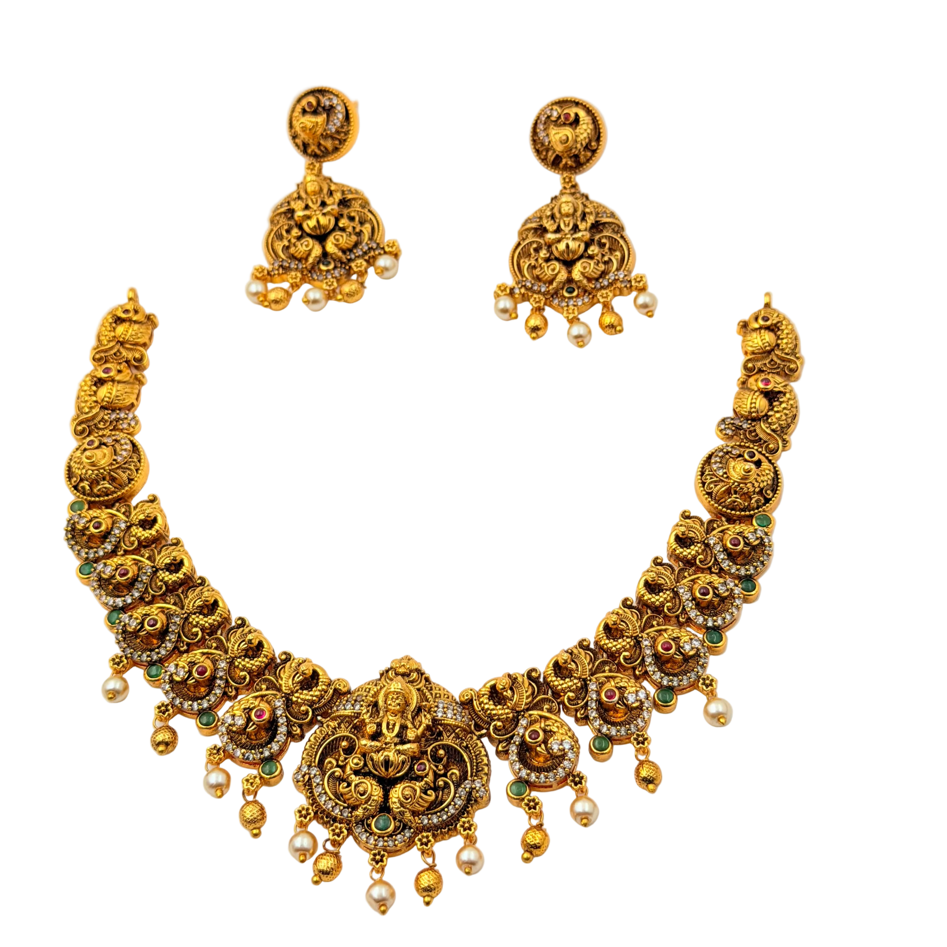 Gold necklace and earrings set on a white background
