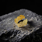 Gold decorative cuff on a textured black surface