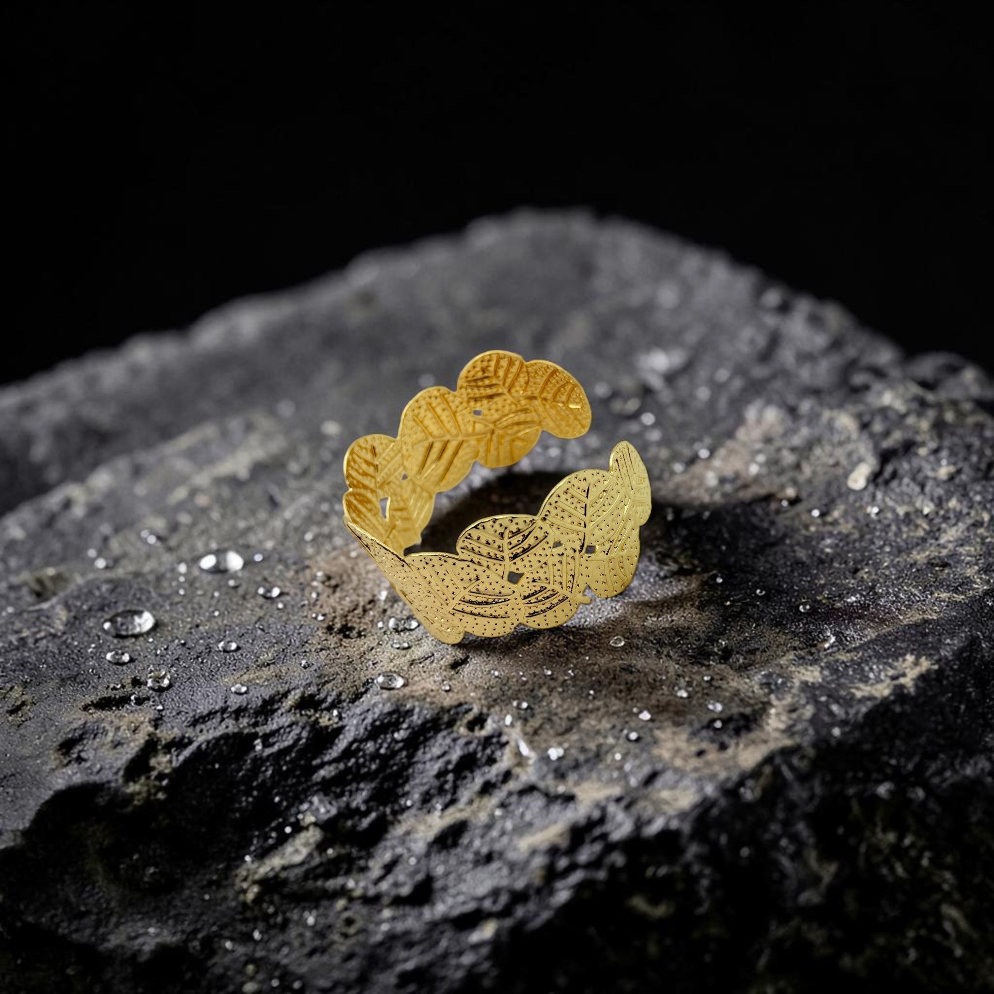 Gold decorative cuff on a textured black surface