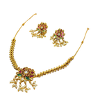 Gold necklace with floral design and pearl-like beads on a white background