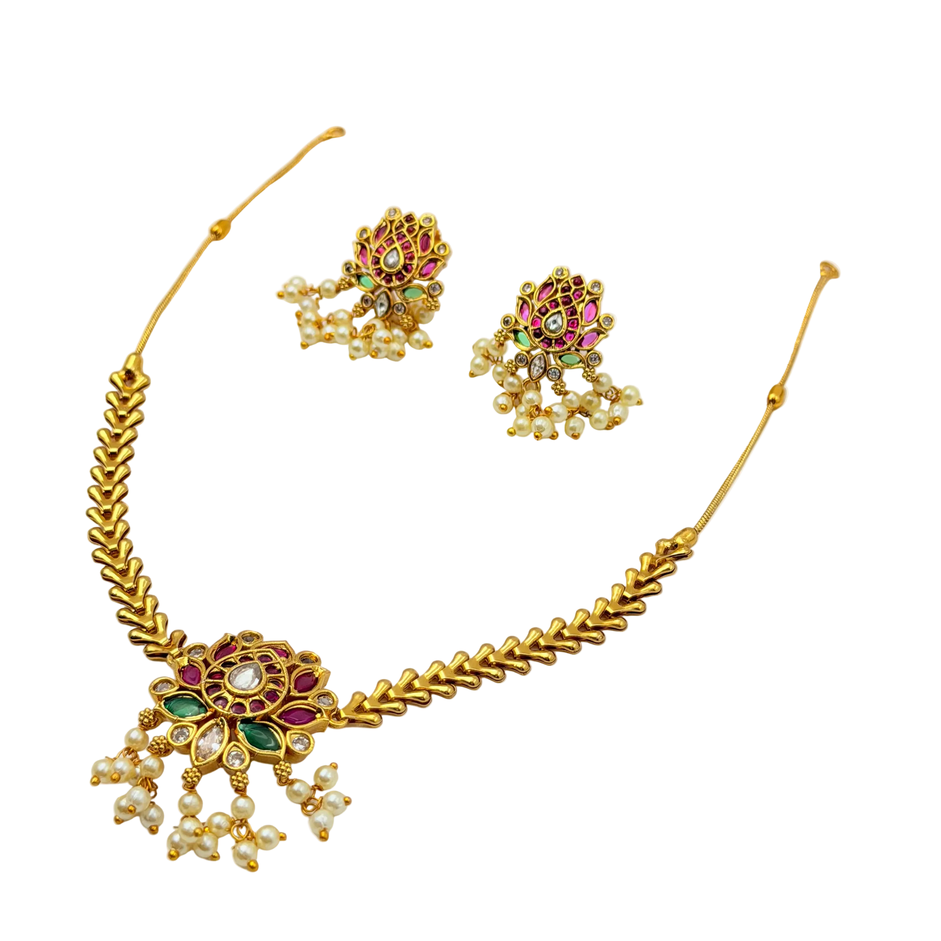 Gold necklace with floral design and pearl-like beads on a white background