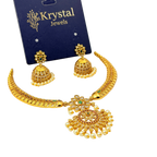 Gold jewelry set with necklace and earrings on a Krystal Jewels card.