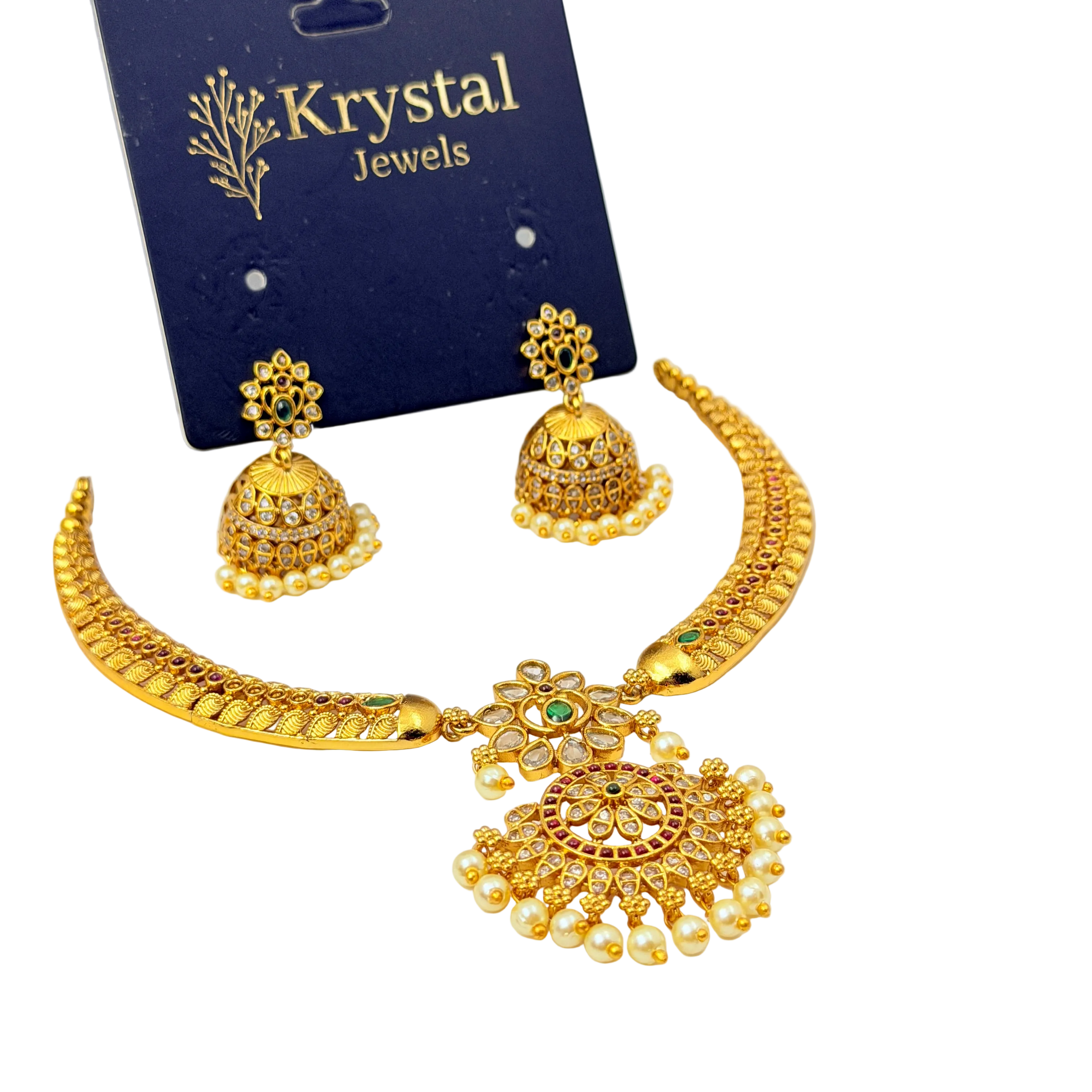 Gold jewelry set with necklace and earrings on a Krystal Jewels card.