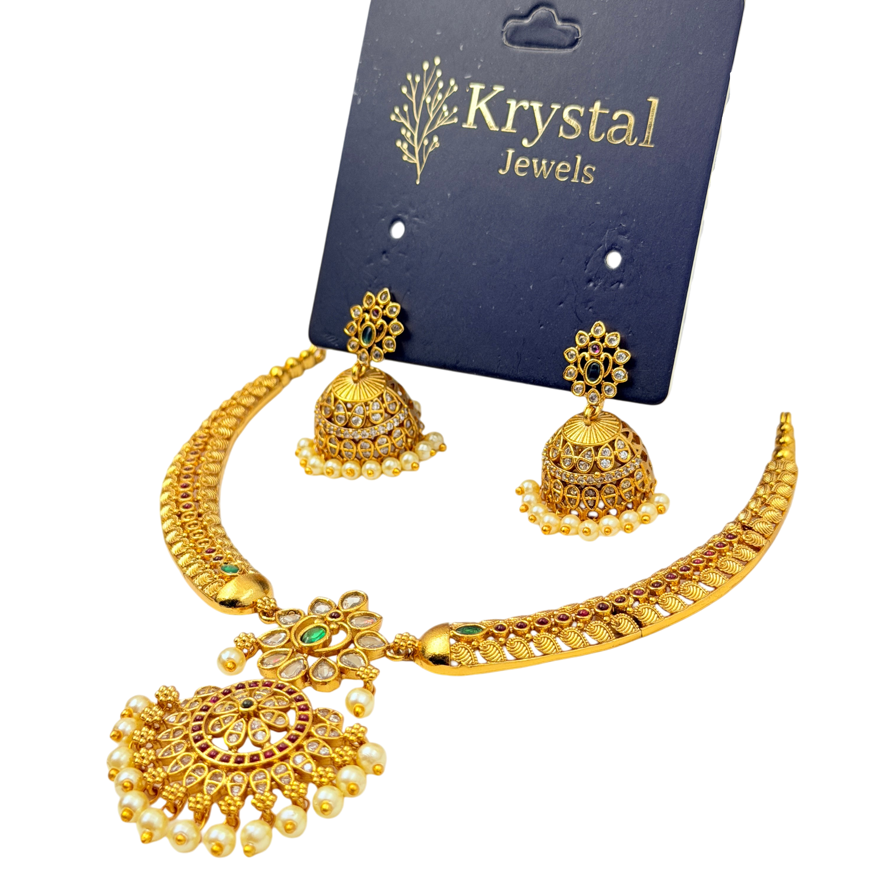 Gold necklace and earrings set on a Krystal Jewels card