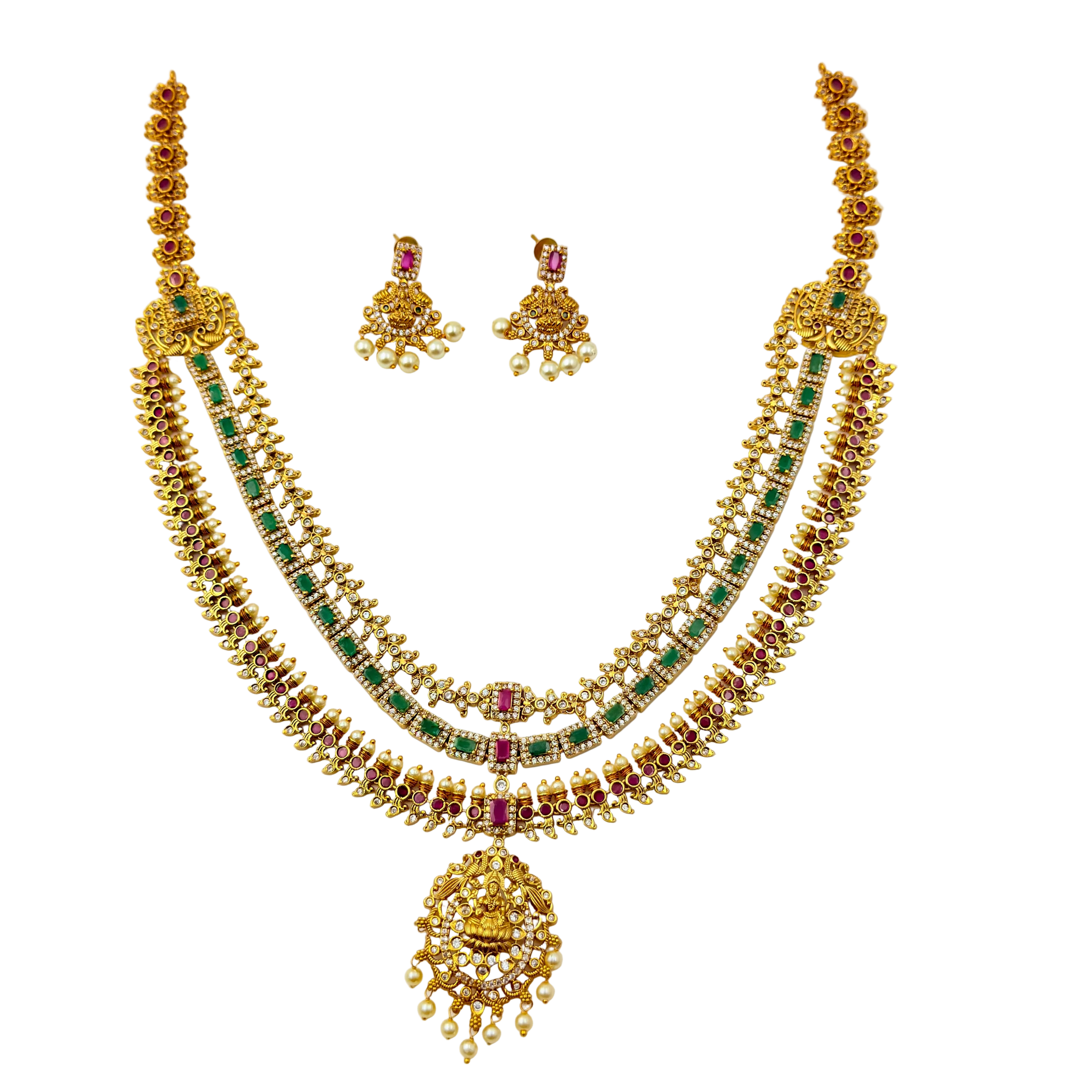 Gold necklace with green and red stones on a white background