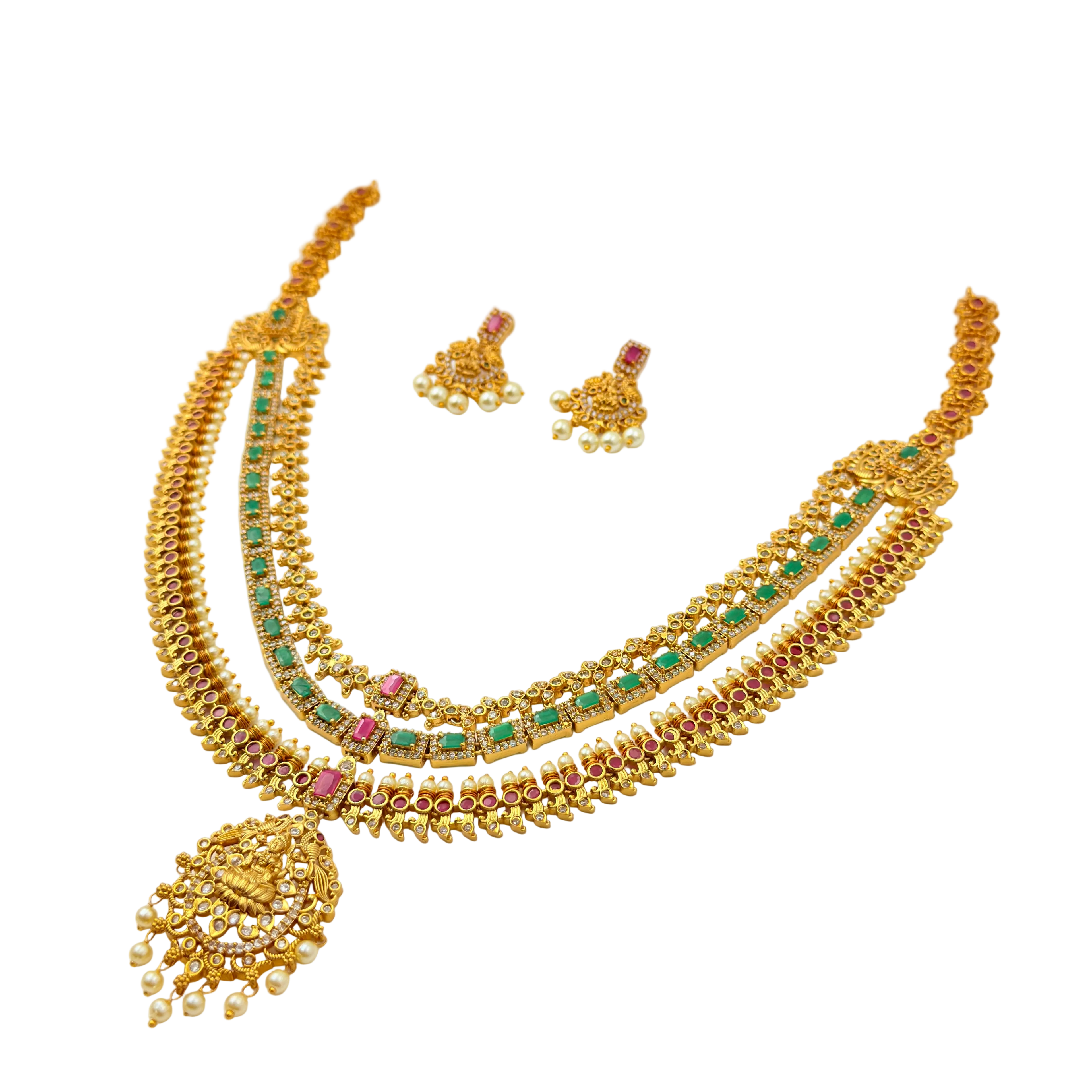 Gold necklace with green and red stones on a white background