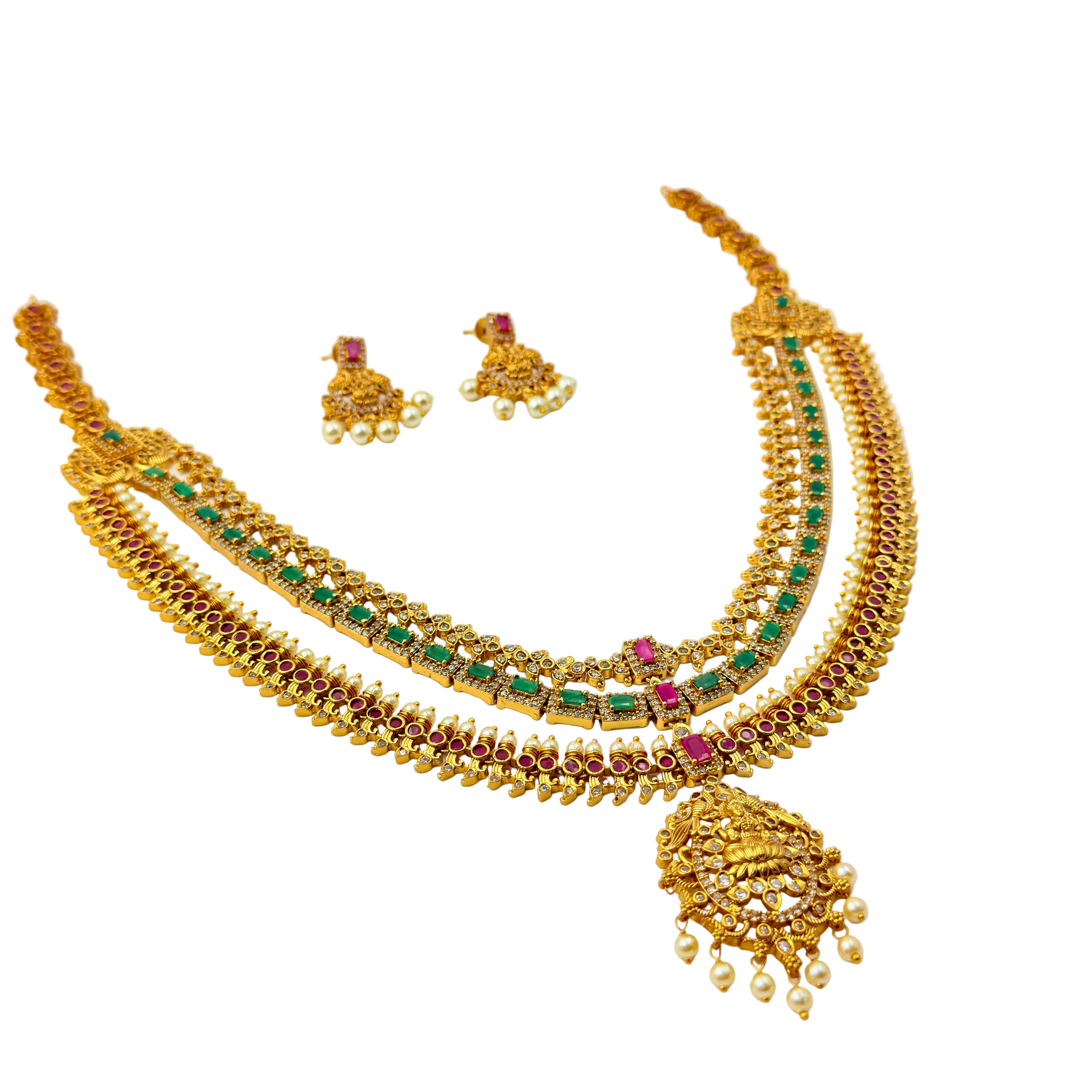 Gold necklace with green and red stones on a white background