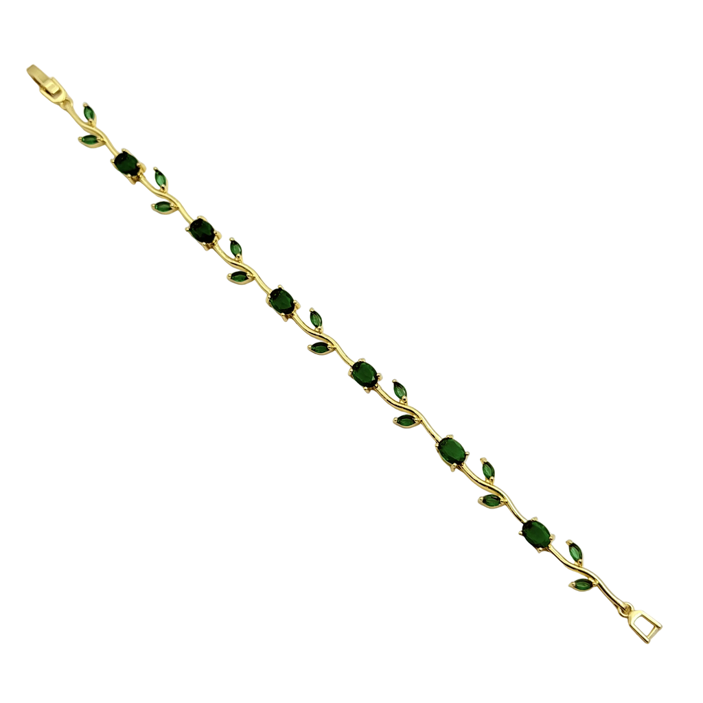 Gold bracelet with green gemstones on a white background