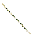 Gold bracelet with green gemstones on a white background