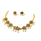 Gold necklace with floral designs and pearl beads on a white background