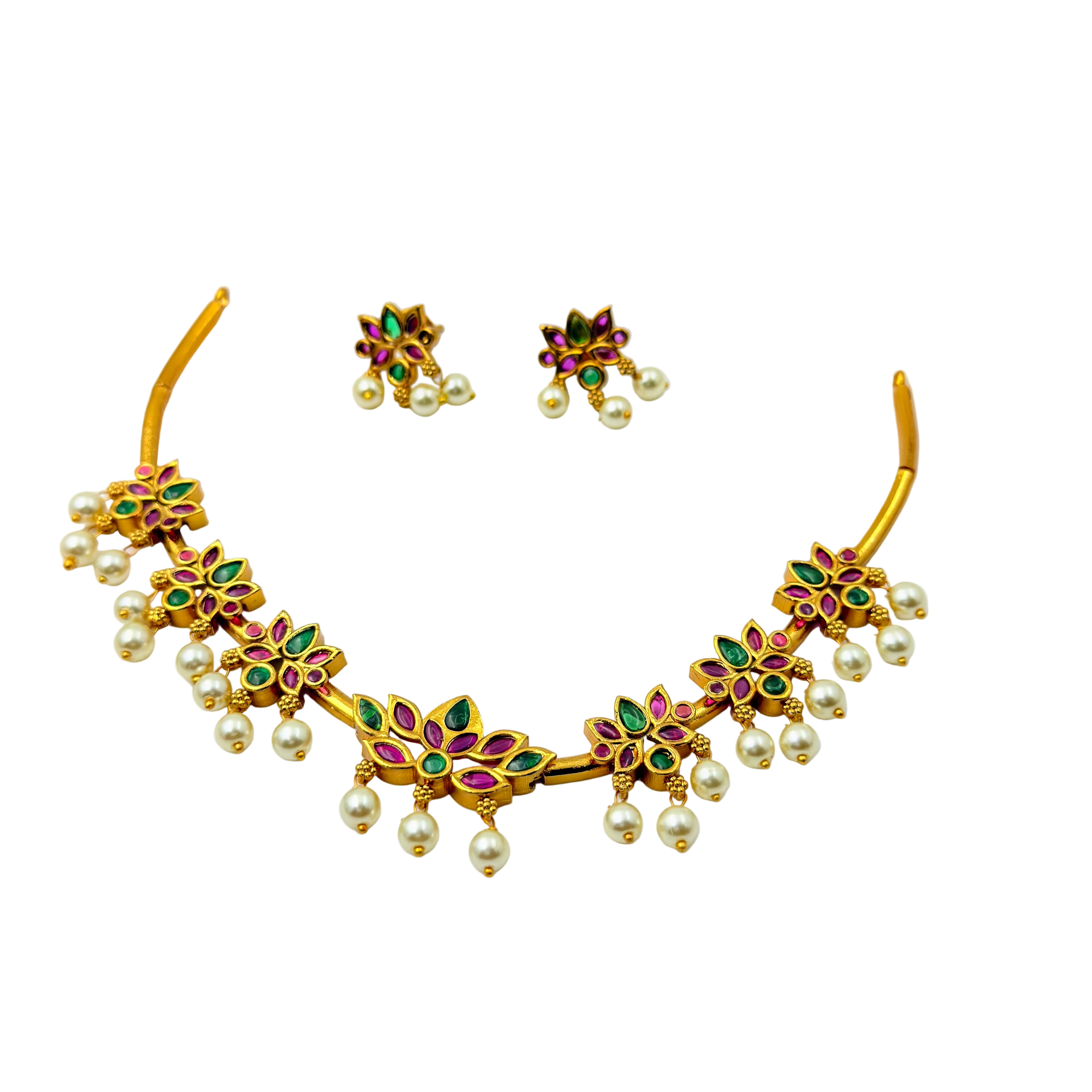 Gold necklace with floral designs and pearl beads on a white background