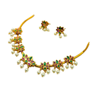Gold necklace with pearls and gemstones on a white background