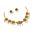 Gold necklace with pearls and gemstones on a white background