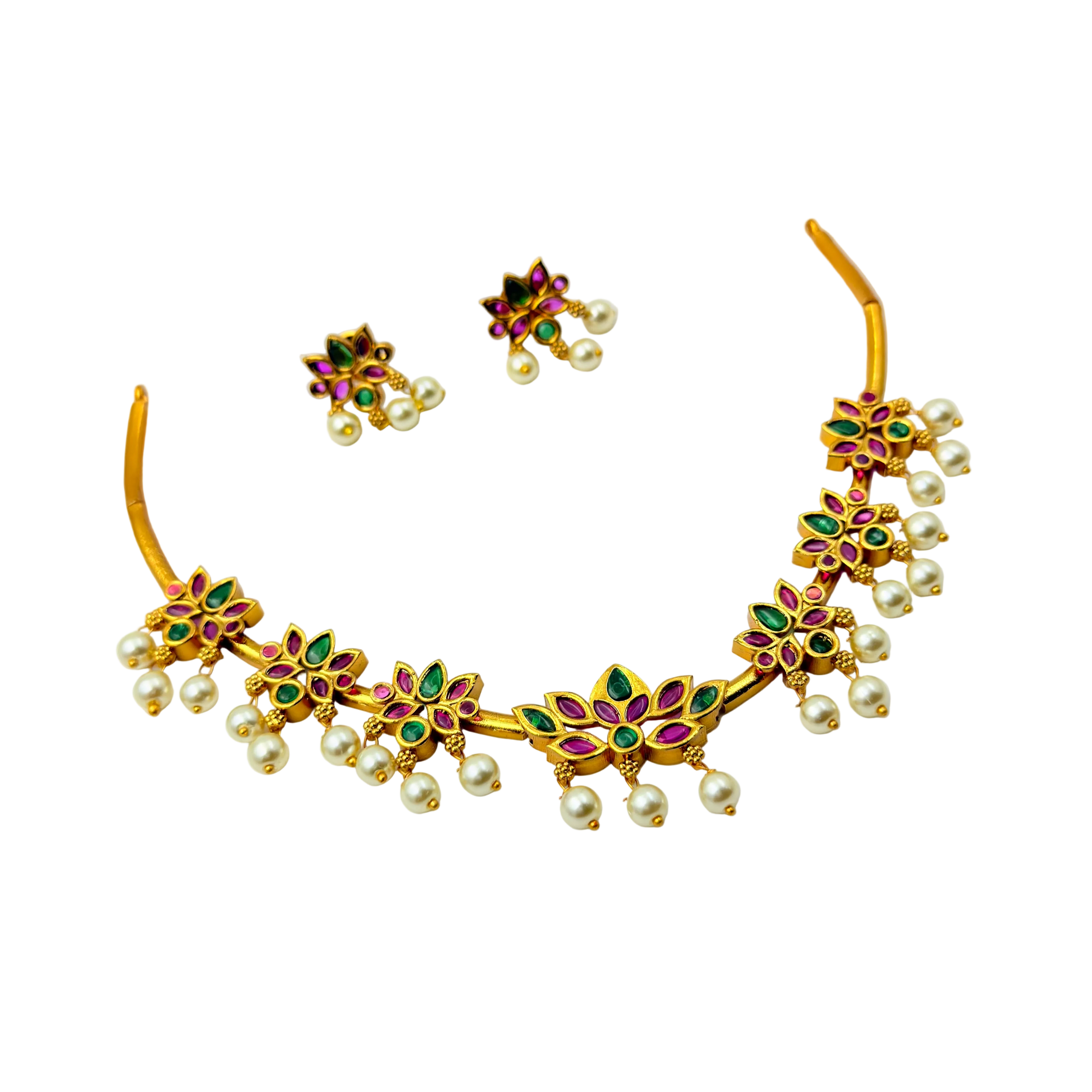 Gold necklace with pearls and gemstones on a white background