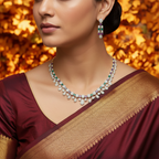 Gold-tone amethyst and emerald crystal necklace set with drop earrings, worn by model in maroon saree