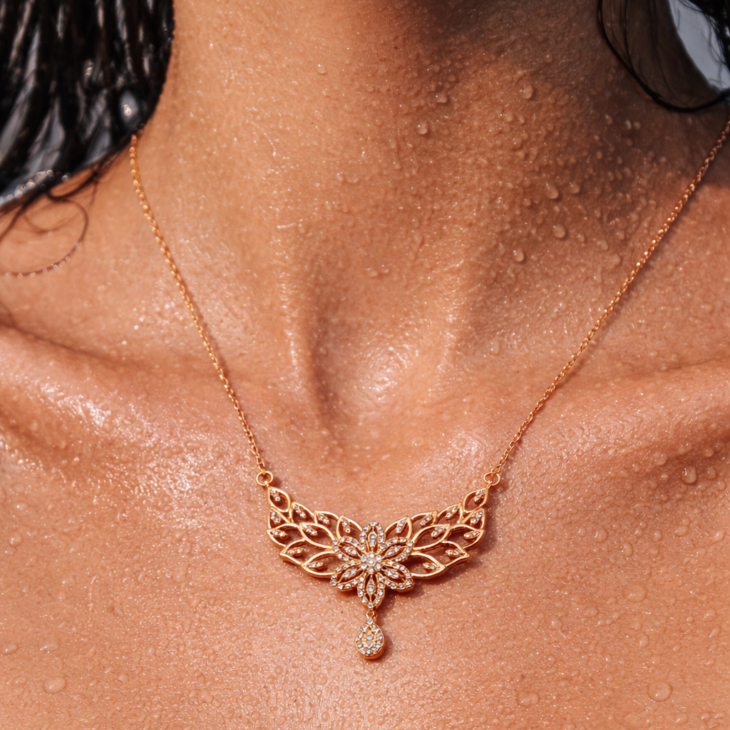 Rose gold necklace with a butterfly design on a person's neck