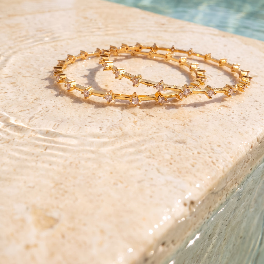 Gold Prismatic Bangle — festive editorial poolside view, Krystal Jewels