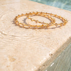 Gold Prismatic Bangle — festive editorial poolside view, Krystal Jewels